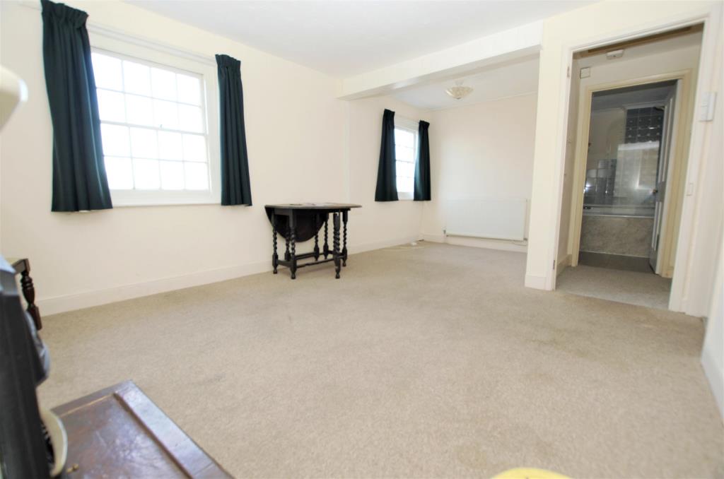 Lot: 73 - PAIR OF COTTAGES WITH CENTRAL STORE - Living room at Castle Street Ryde Isle of Wight